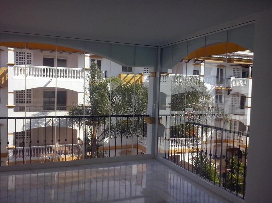 Cortinas de cristal en terrazas: Trabajos de NeoGlass Cortinas de cristal en terrazas: Trabajos de NeoGlass