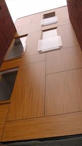 Fachada con MEG madera. Fachada con MEG madera.