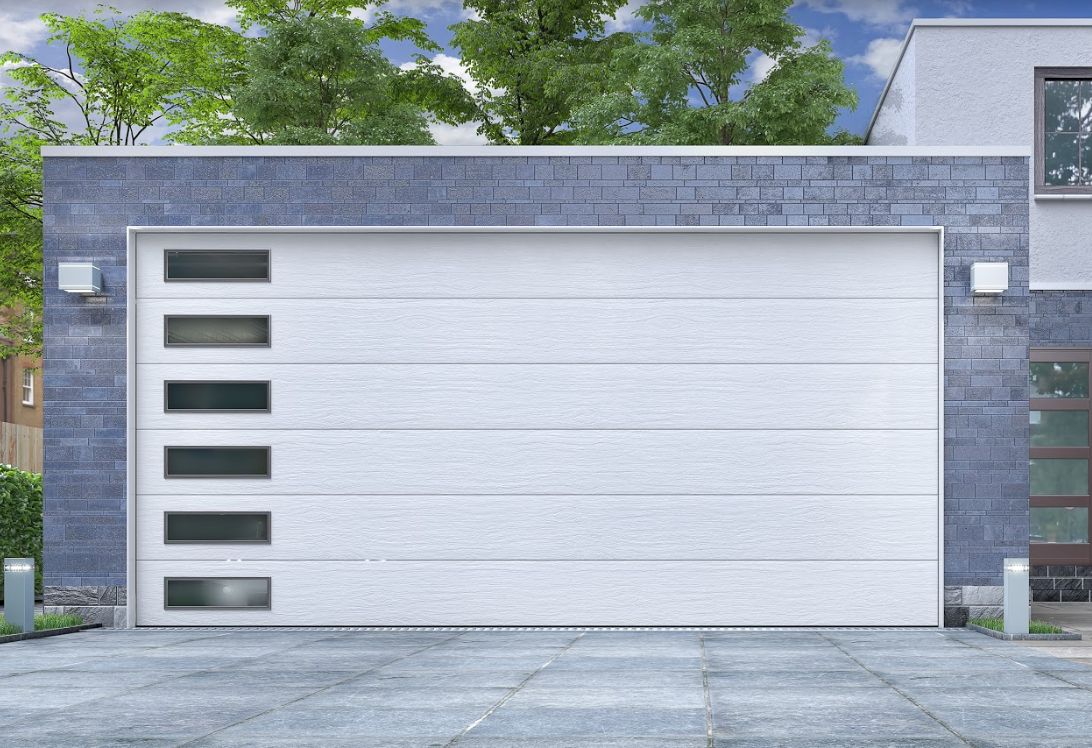 Adaptación de puertas de garaje a normativa: Servicios de Elevasistem Adaptación de puertas de garaje a normativa: Servicios de Elevasistem